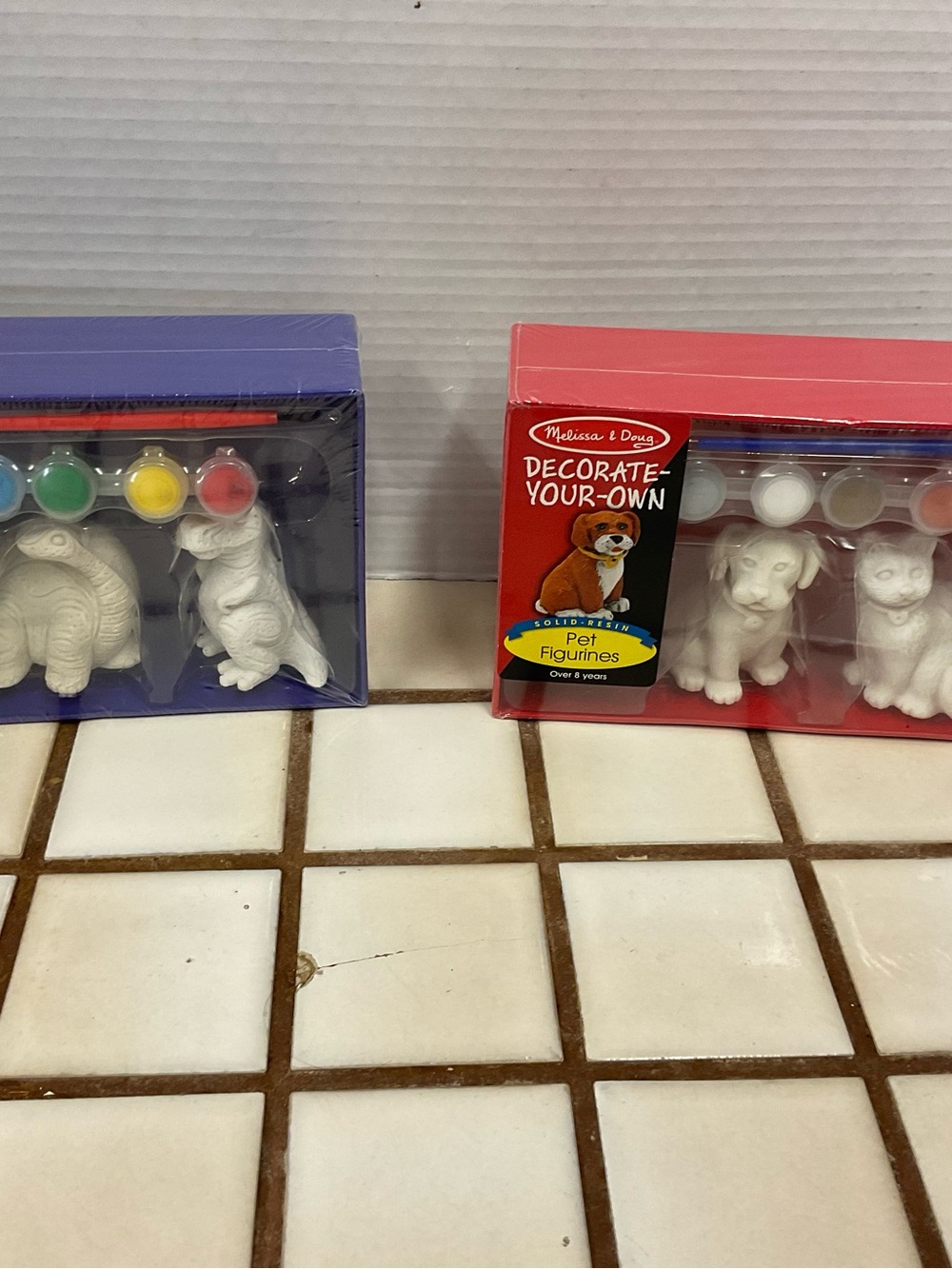 Melissa & Doug Paint-Your-Own Pet Figurine Kits with Purple and Red Boxes